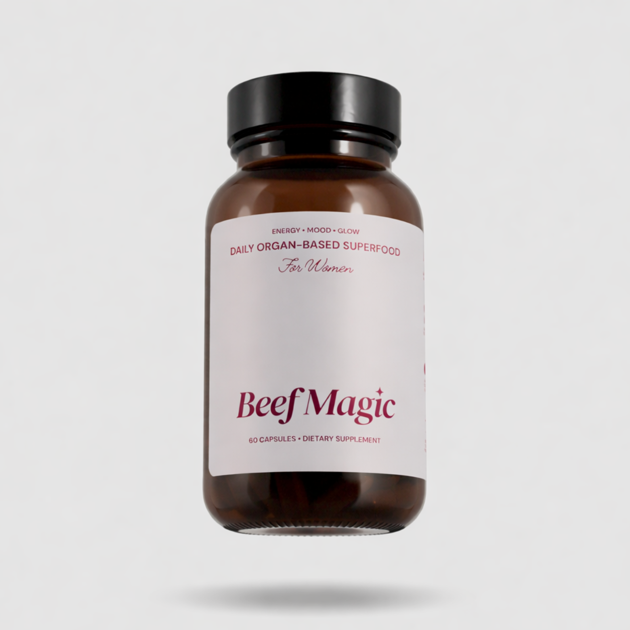 Woman taking Beef Magic beef organ supplement capsules daily